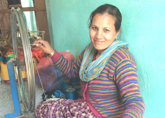 Artisan is spinning yarn